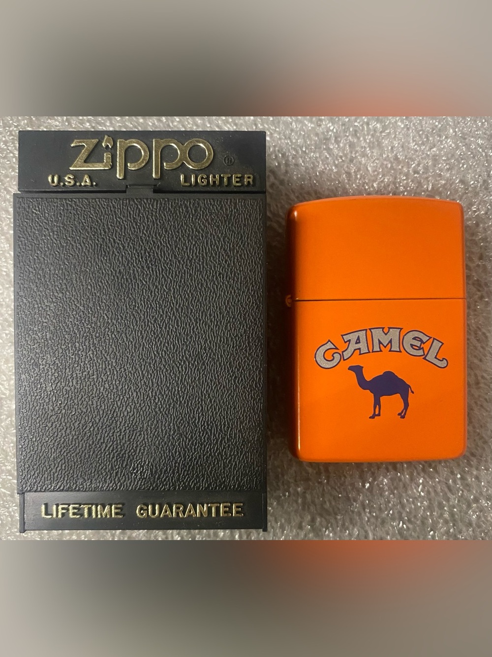 Brand new Camel Collectible Orange Zippo Lighter with Camel Logo and Box.